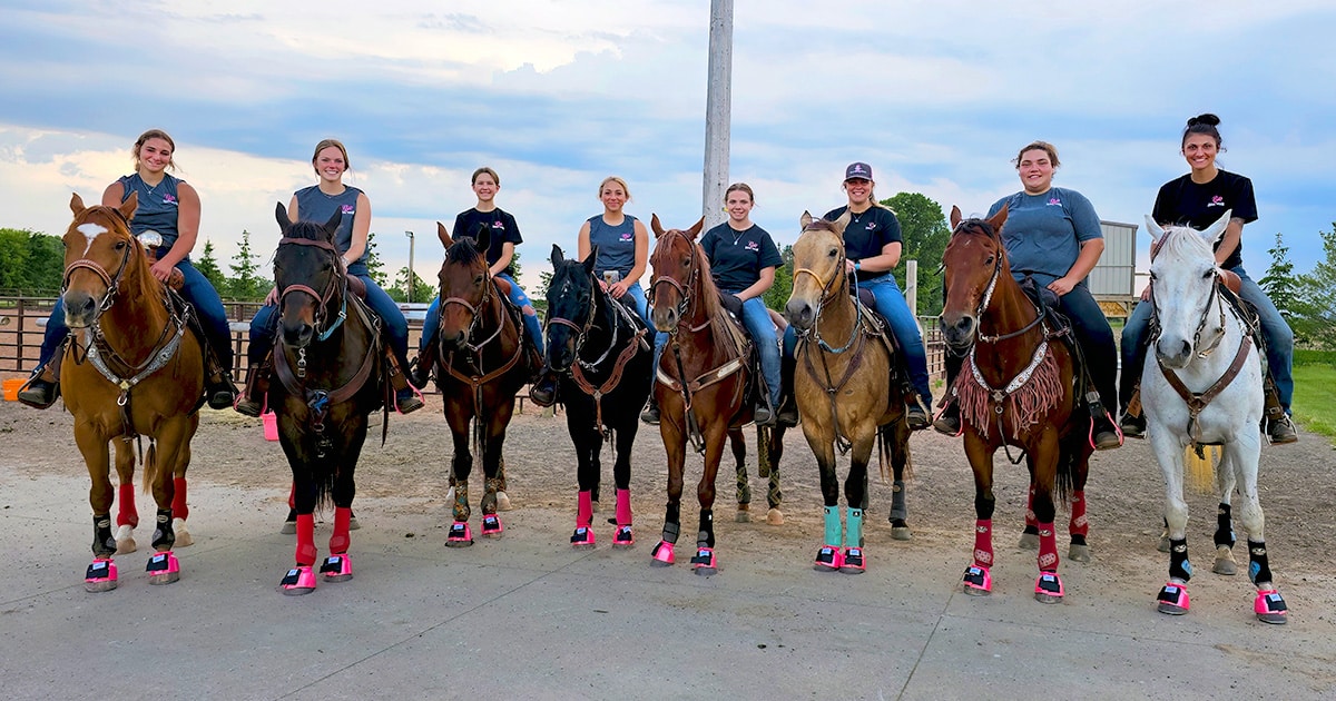 Pink Rebel Riders horse riding group with DAVIS neon pink bell boots.